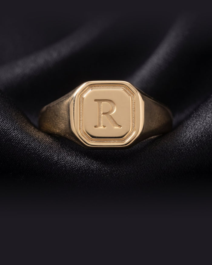 Enzomar solid gold jewelry on dark satin