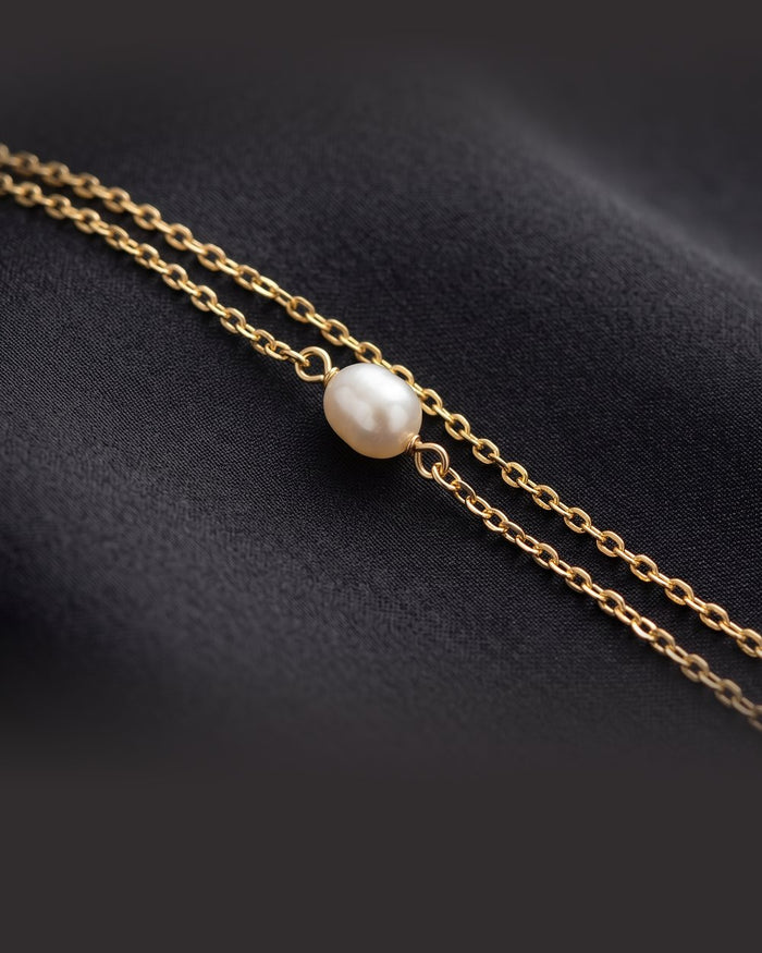 Enzomar solid gold jewelry on dark satin