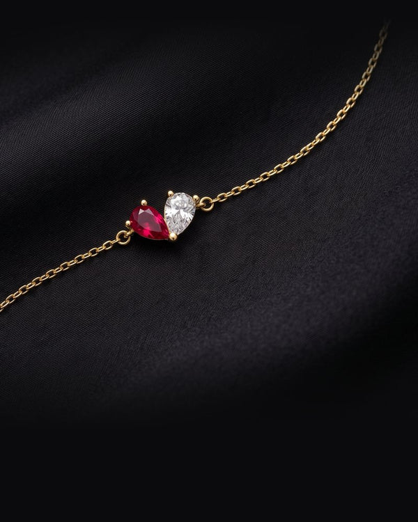 Enzomar solid gold jewelry on dark satin